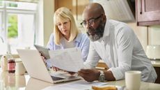 A retired couple look over their finances.