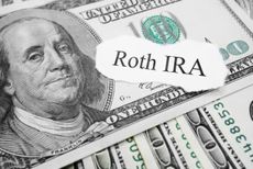 Roth IRA paper message on hundred dollar bills.