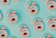 rendering of a bunch of screaming pink alarm clocks